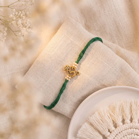 Antique Om Pearl Rakhi Green